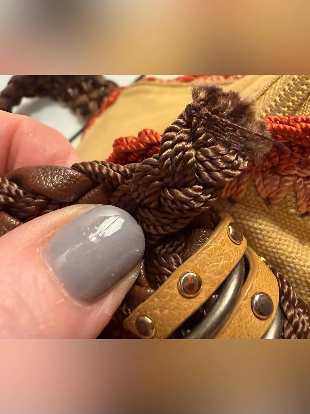 The Sak tan canvas Indio hobo bag with braided brown straps and crochet trim